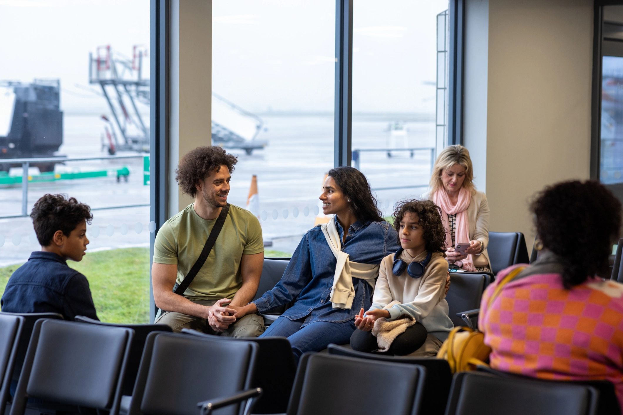 Passengers waiting in a modern airport terminal