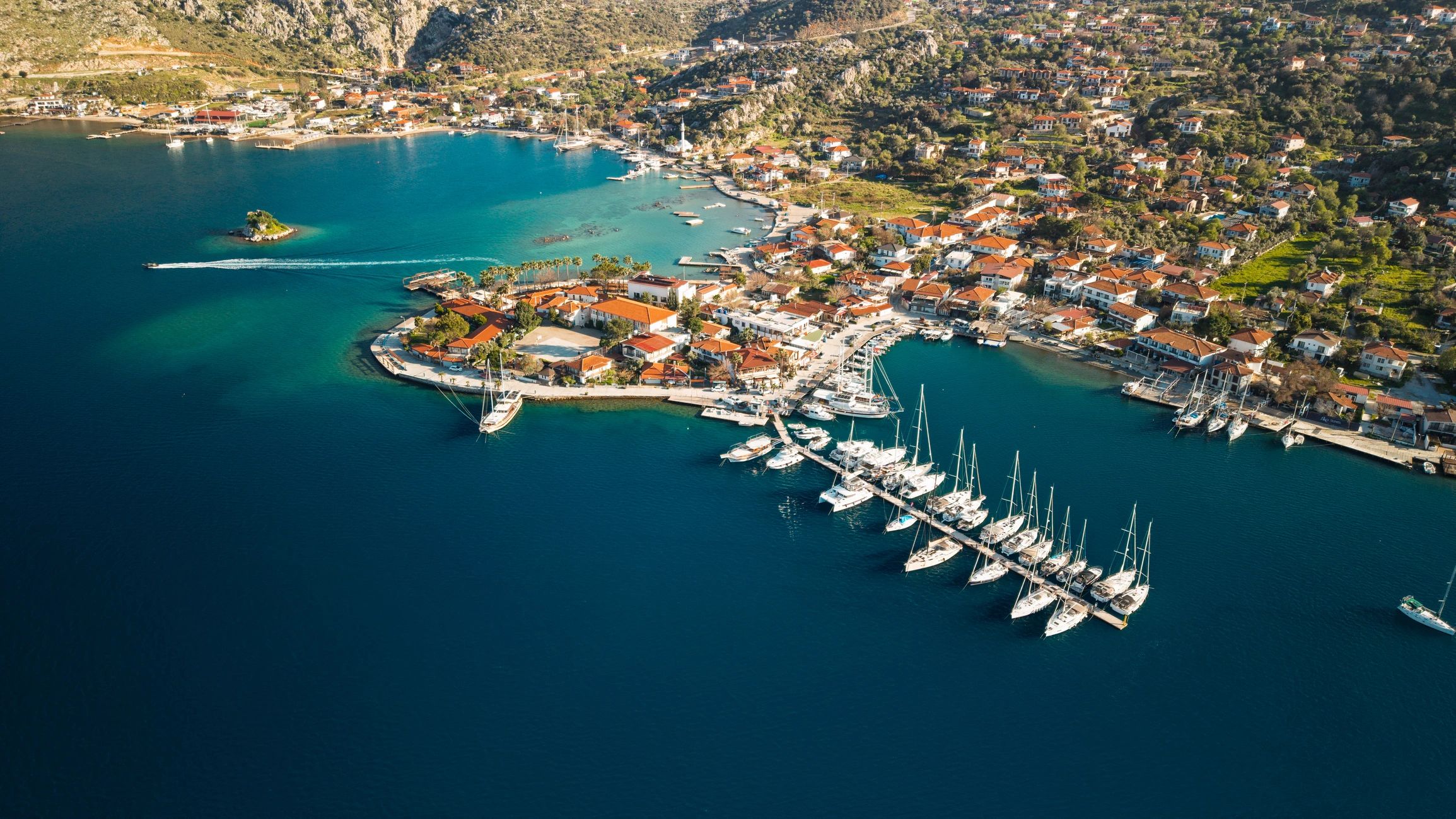 Coastal village and turquoise bay holiday destination