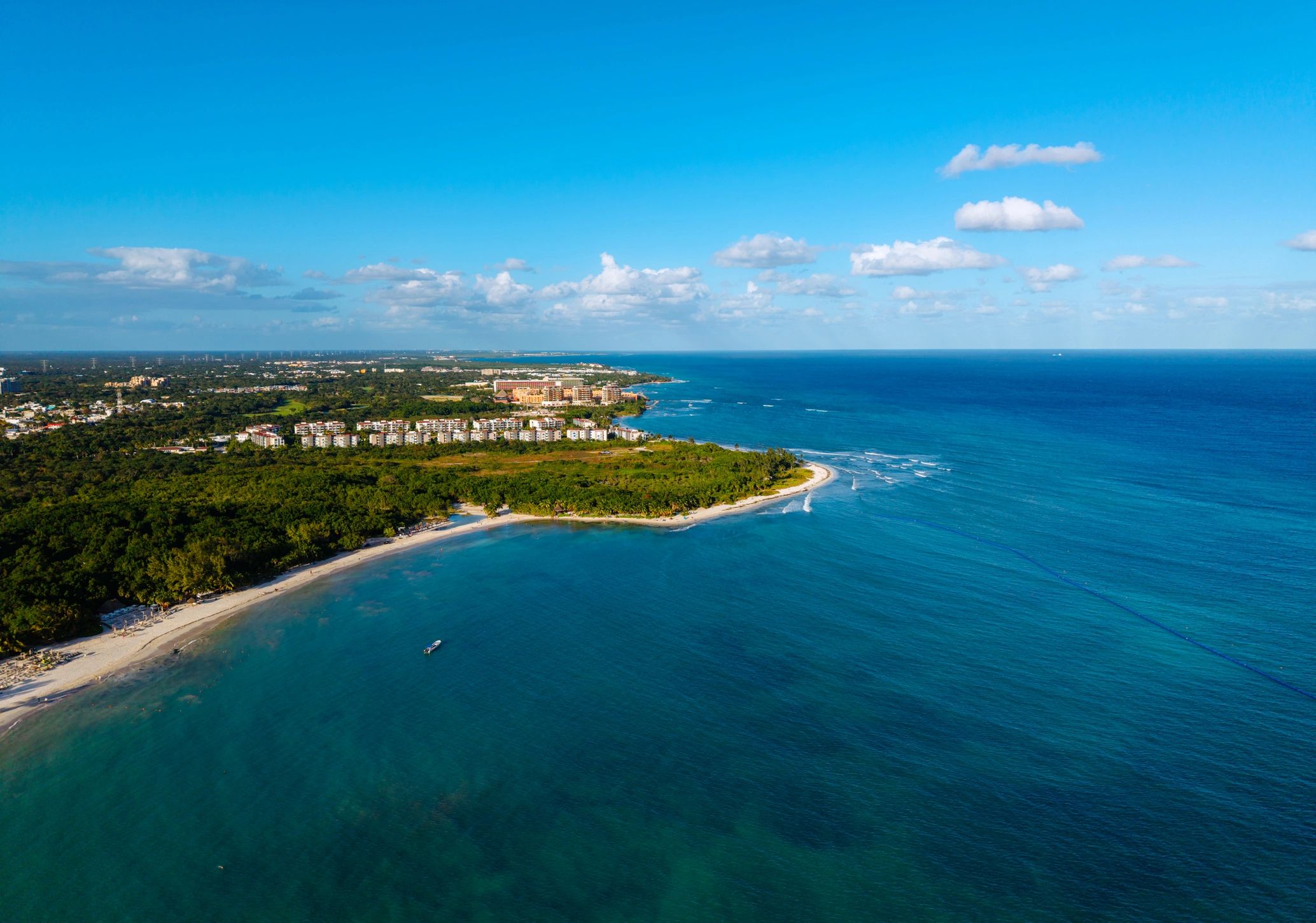 Aerial view of a tropical beach resort coastline